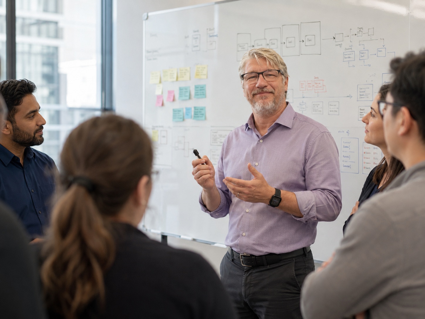 Preston McCauley working with a team to simplify a complex business workflow