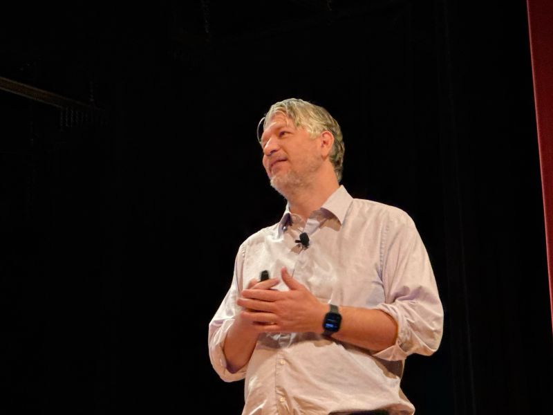 Preston McCauley speaking on stage about AI systems